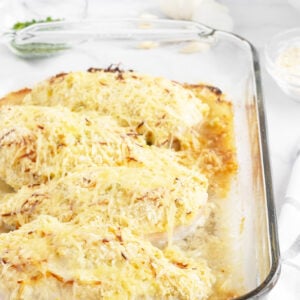 Artichoke Chicken in a clear baking pan
